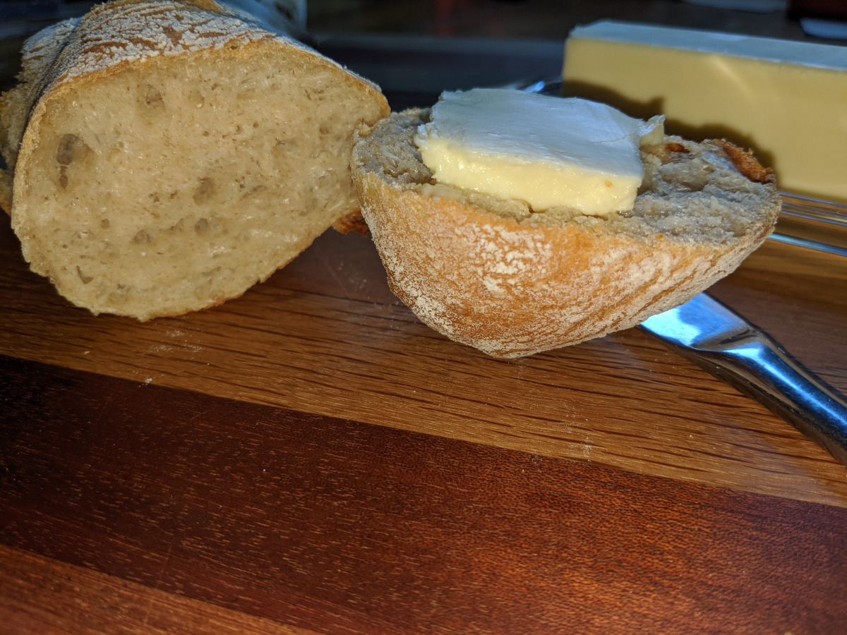 Cut baguette with butter