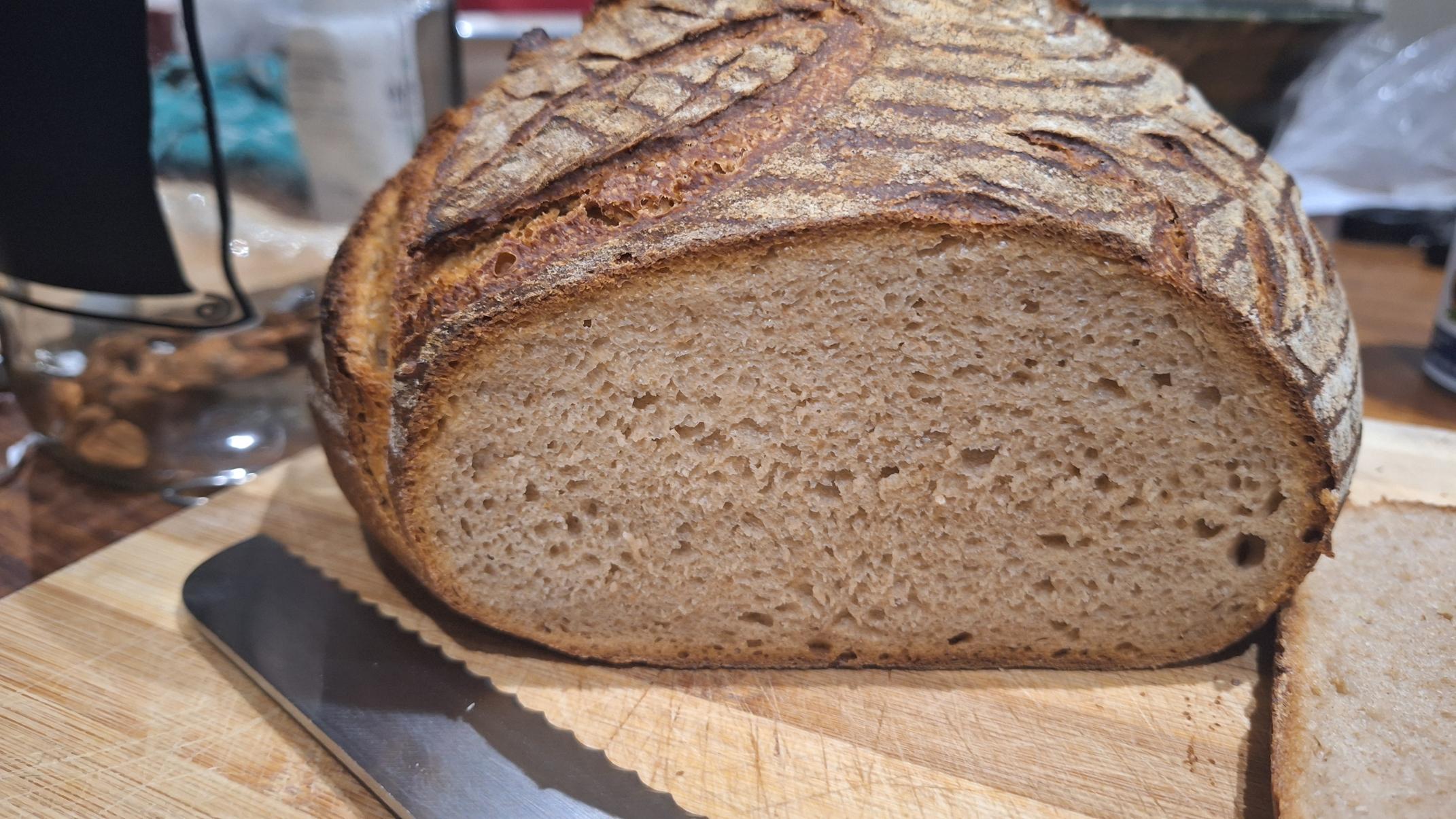 Loaf with patterned score and showing crumb