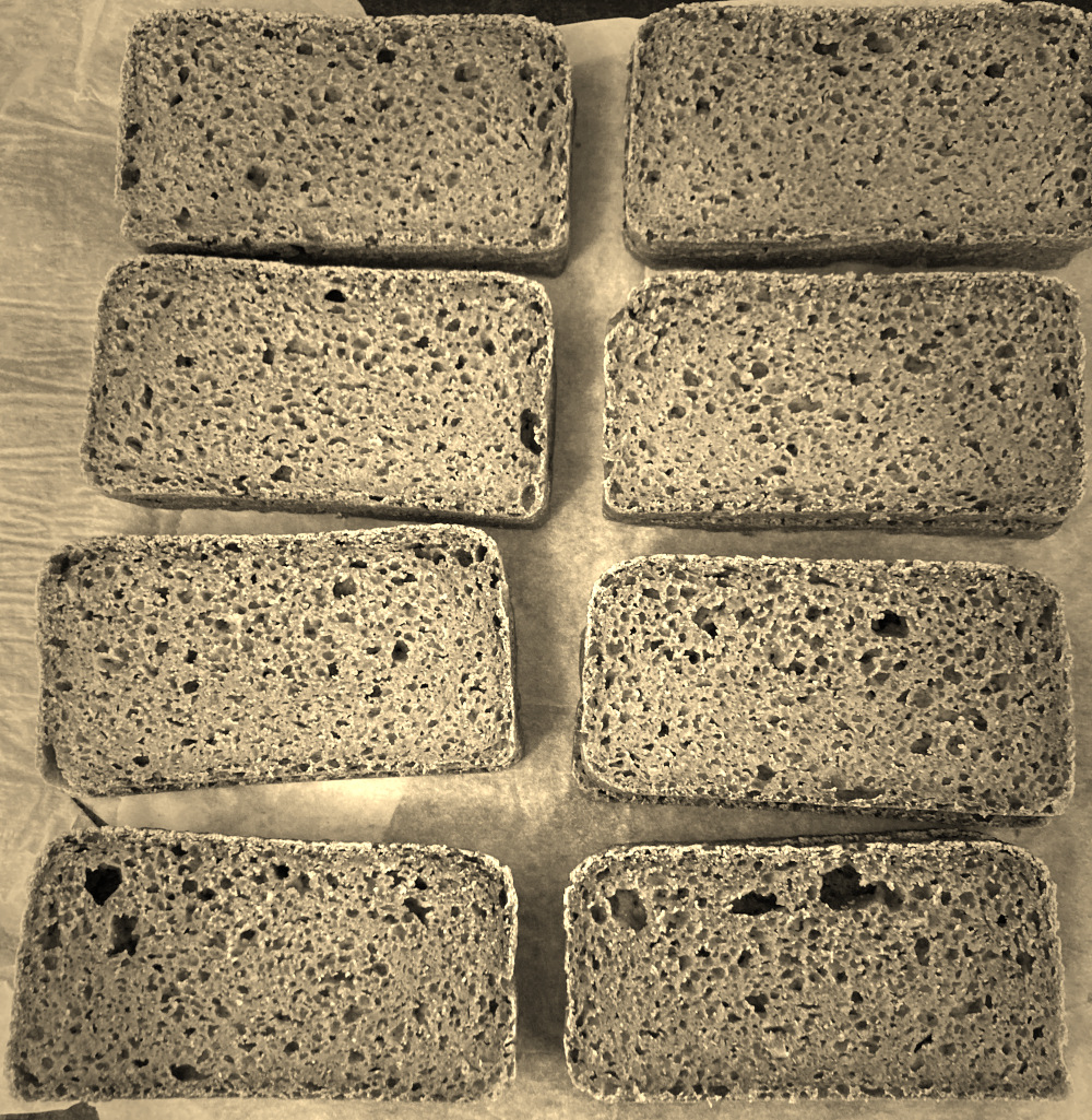 Sepia filter over slices of a very squat bread.