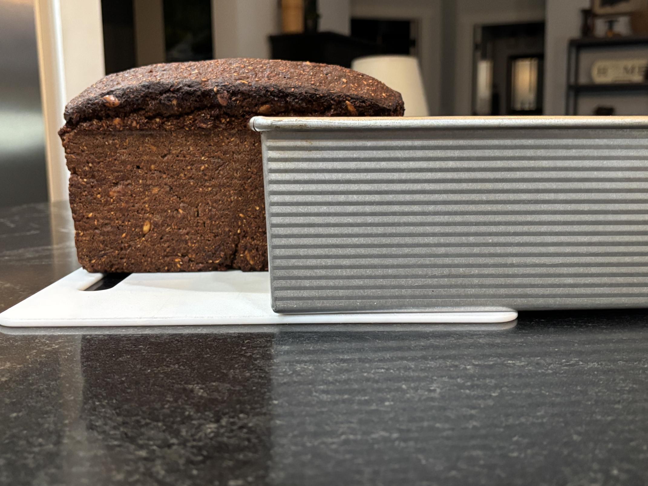 A picture of the loaf next to the pan, to show their comparative heights.