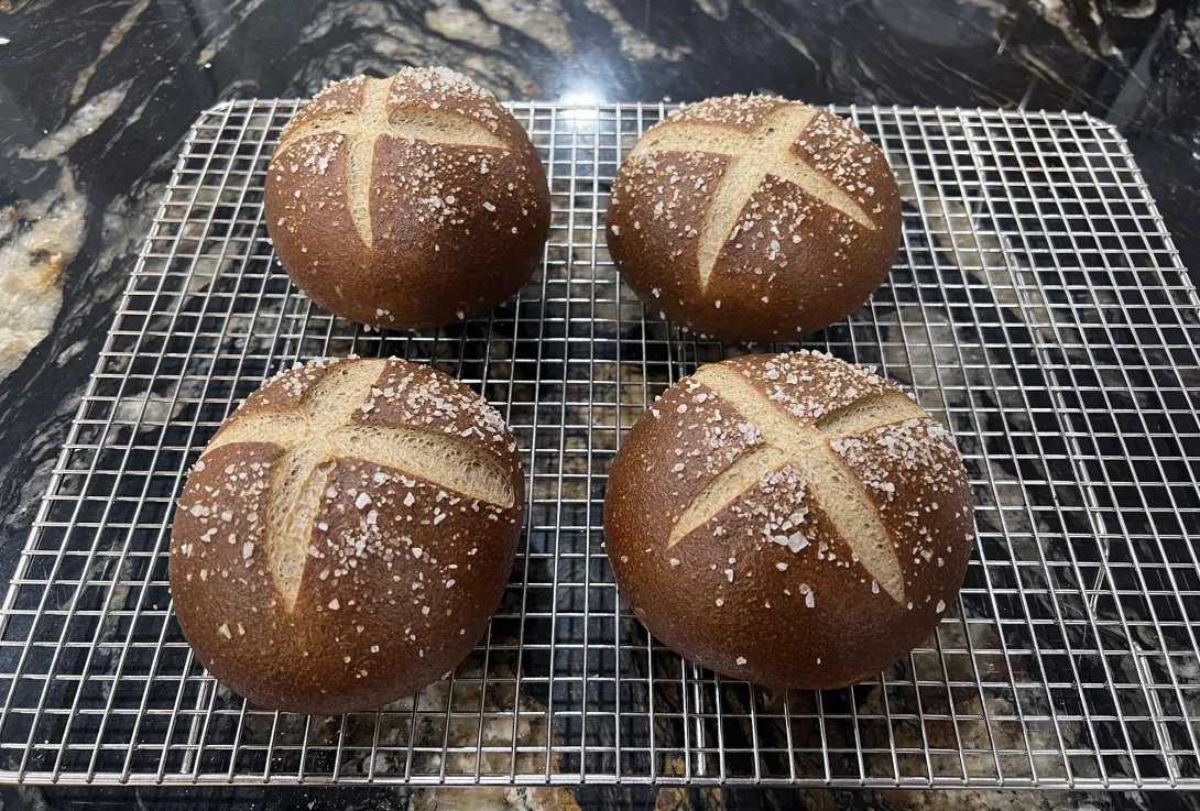 Pretzel rolls on cooling rack