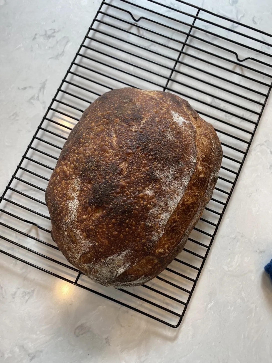 Loaf of sourdough after scoring difficult