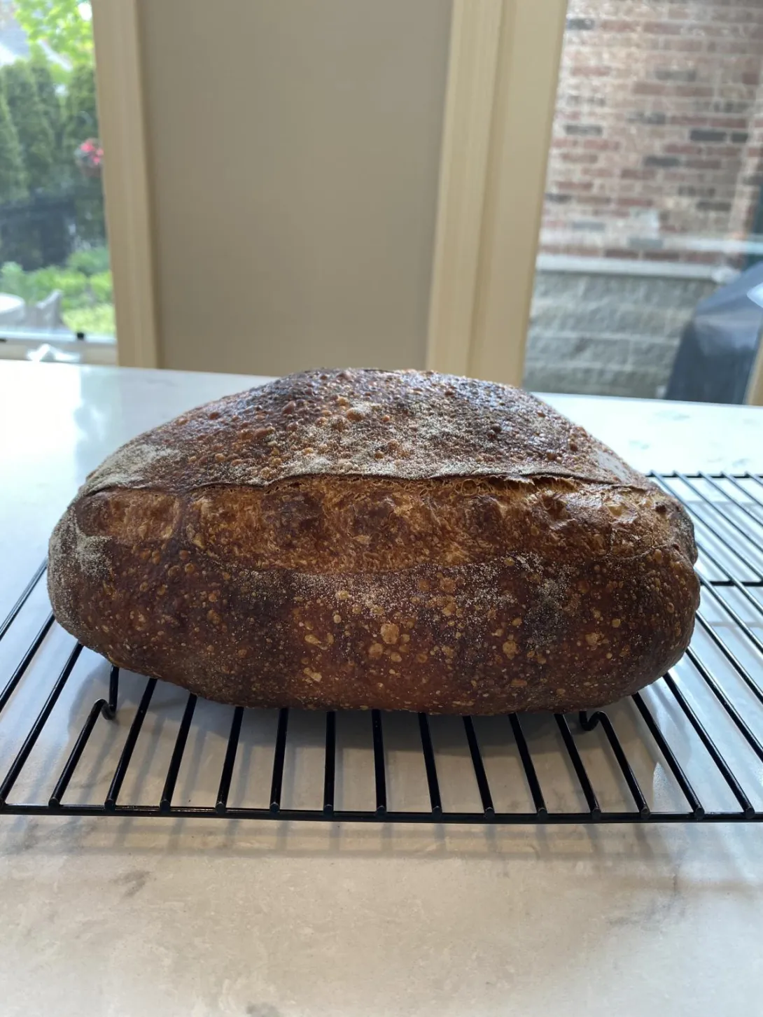 Loaf of sourdough batard from the side